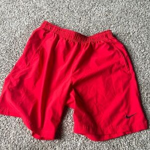 Men’s red Nike athletic shorts